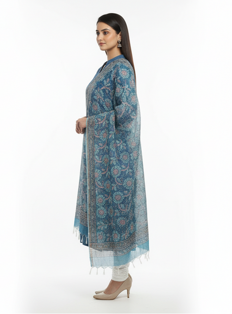 Woman wearing a blue patterned kurta with white pants on a white background