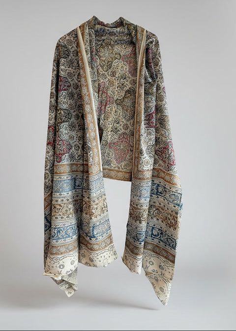 Kalamari Patterned scarf draped over a white background