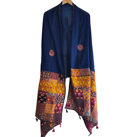 Close-up of hand mirror-work applique and Ajrakh patchwork border on navy blue dupatta
