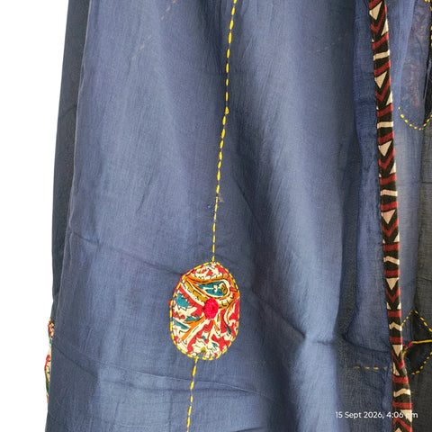 Close-up of hand mirror-work applique and Ajrakh patchwork border on navy blue dupatta