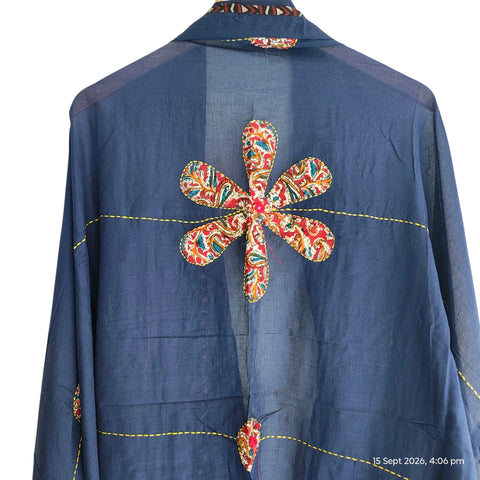 Close-up of hand mirror-work applique and Ajrakh patchwork border on navy blue dupatta