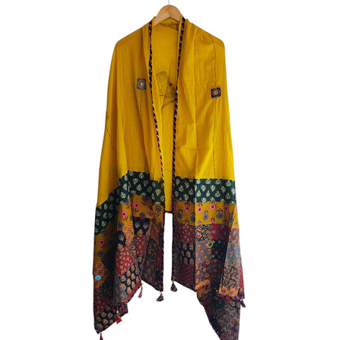 Close-up of hand mirror-work applique and Ajrakh patchwork border on mustard dupatta