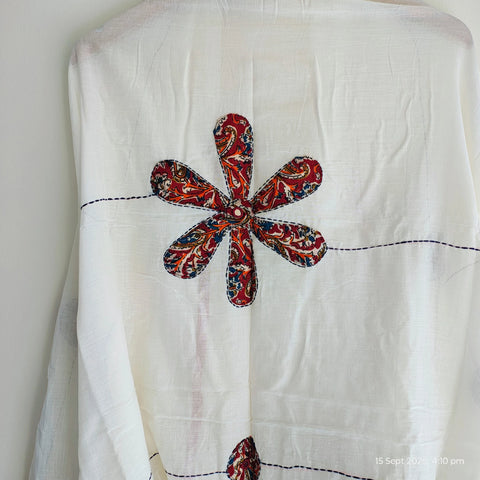 Close-up of hand mirror-work applique and Ajrakh patchwork border on ivory dupatta