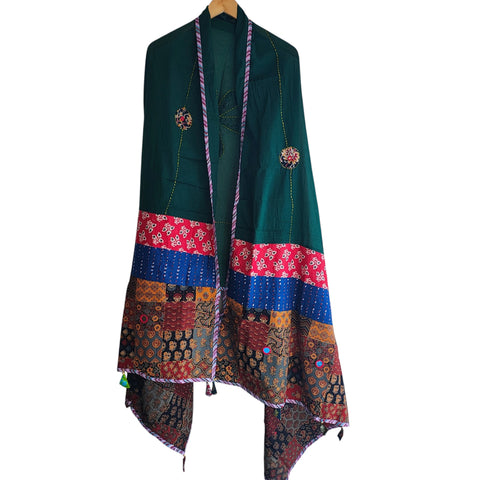 Close-up of hand mirror-work applique and Ajrakh patchwork border on bottle green dupatta
