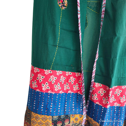 Close-up of hand mirror-work applique and Ajrakh patchwork border on bottle green dupatta