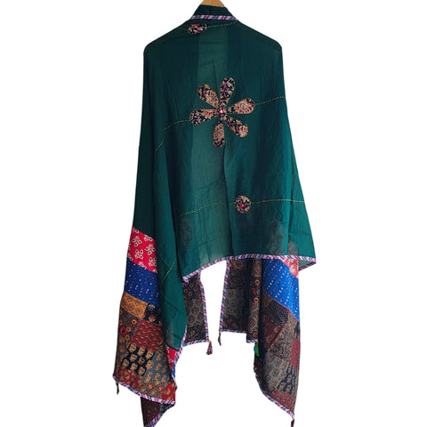 Close-up of hand mirror-work applique and Ajrakh patchwork border on bottle green dupatta