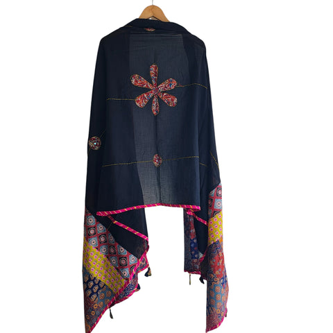 Close-up of hand mirror-work applique and Ajrakh patchwork border on black dupatta