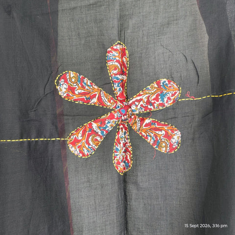 Close-up of hand mirror-work applique and Ajrakh patchwork border on black dupatta