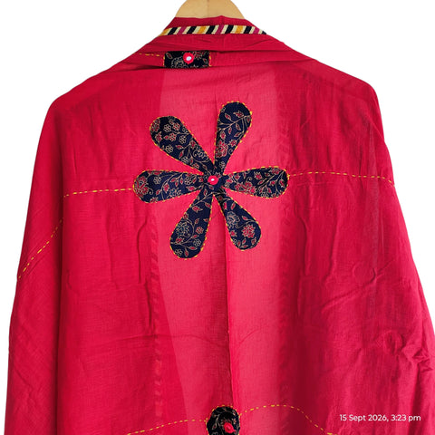 Close-up of hand mirror-work applique and Ajrakh patchwork border on red dupatta