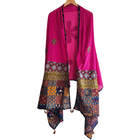 Close-up of hand mirror-work applique and Ajrakh patchwork border on rani pink dupatta