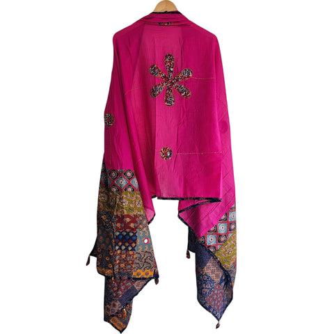 Close-up of hand mirror-work applique and Ajrakh patchwork border on rani pink dupatta