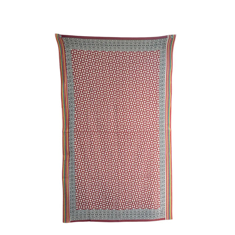 Rust red cotton dupatta with white pinwheel block print and black geometric border, flat lay