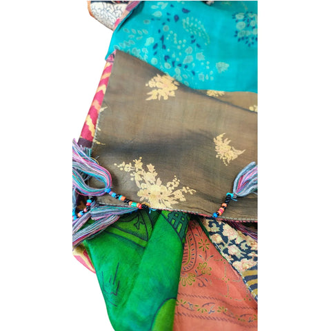 Warm-toned mixed print silk patchwork stole – close-up of orange and teal patches