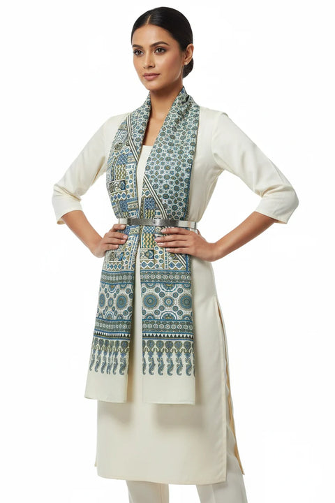 Woman wearing a white kurta with a patterned shawl on a white background