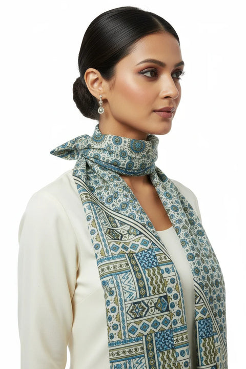 Woman wearing a patterned scarf on a white background