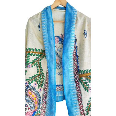 Close-up of hand painted Radha Krishna motif with blue border on cotton silk dupatta