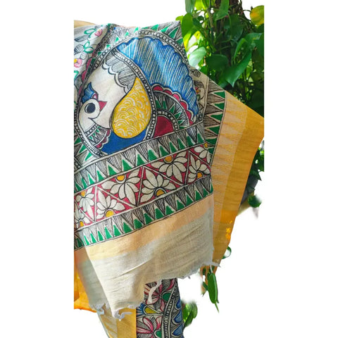 Close-up of hand painted peacock mandala motif on mustard Madhubani art dupatta