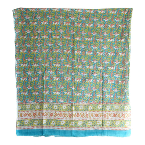 Close-up of green coral tropical Sanganeri block print on blue teal mul cotton – ISYVSK-A20