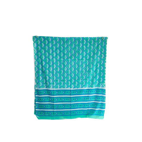 Close-up of teal and blue geometric Sanganeri block print on green mul cotton – ISYVSK-A26